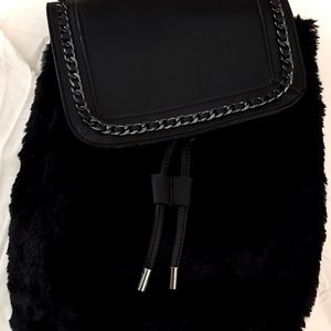 Fuzzy black backpack with leopard interior